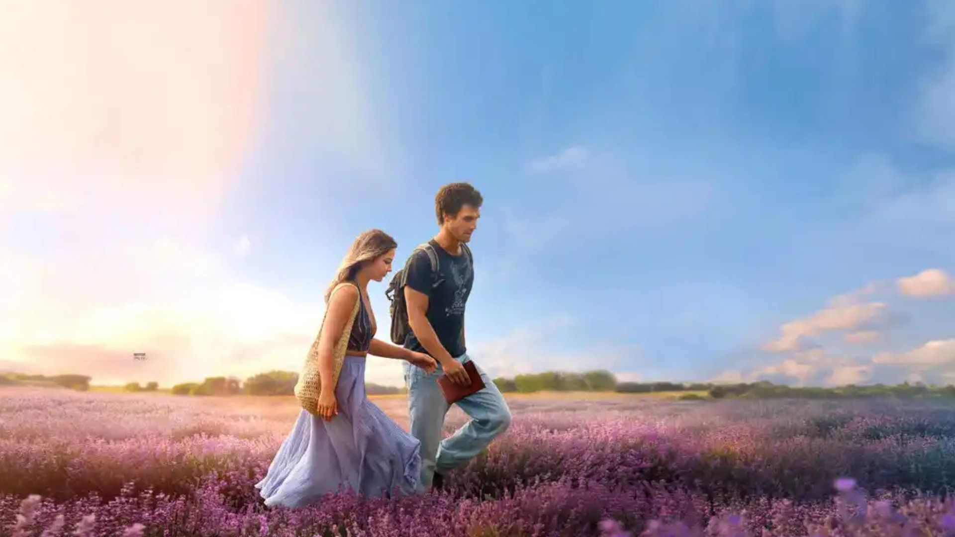 Jack leads Heather by hand through a lavender field