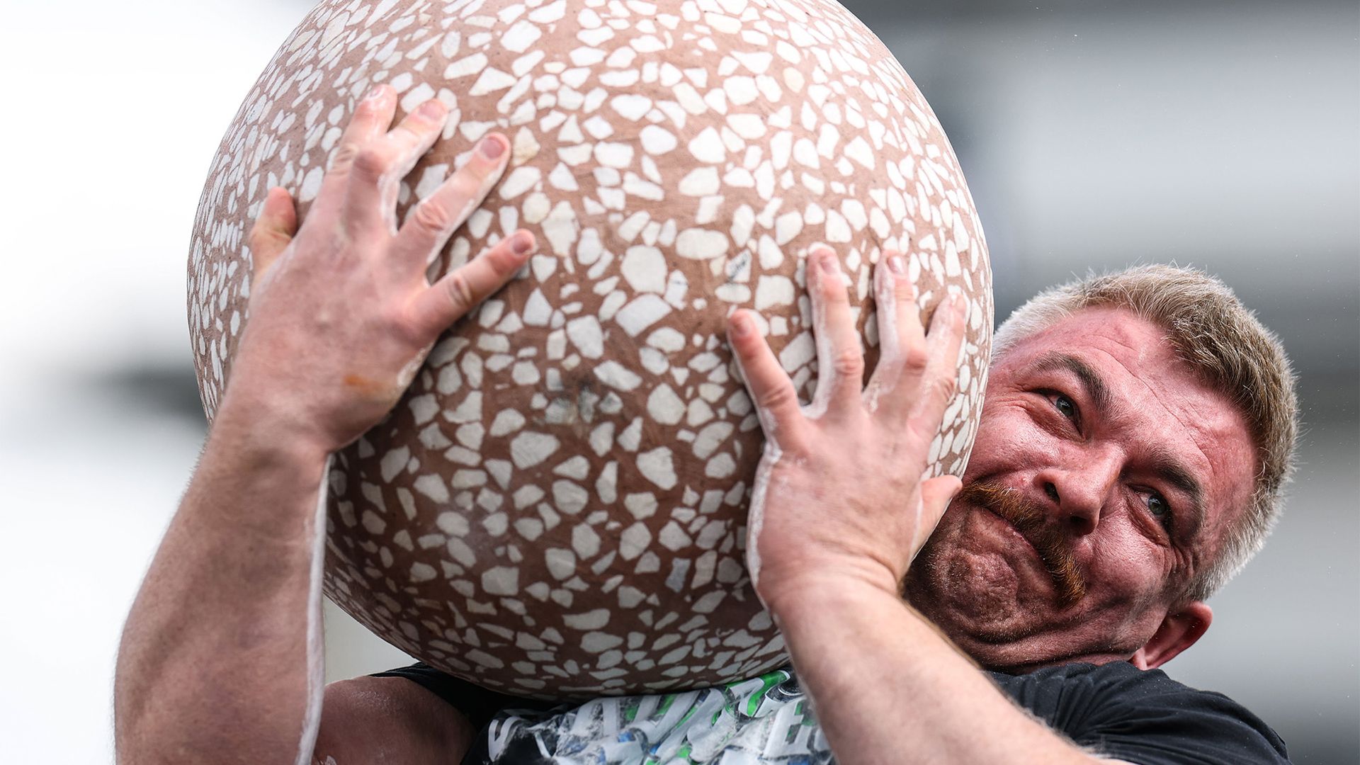 
                                Cathal McNally competes in the Dragon Egg stone lift during the 2026 Ireland's Strongest Man competition in Belfast, Ireland
                            