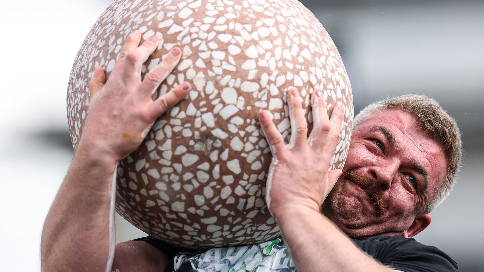 Cathal McNally competes in the Dragon Egg stone lift during the 2026 Ireland's Strongest Man competition in Belfast, Ireland