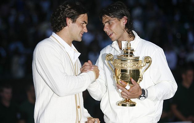 Wimbledon 2008 - Day 13 Roger Federer of Switzerland congratulates Rafael Nadal of Spain in winning the Championship trophy