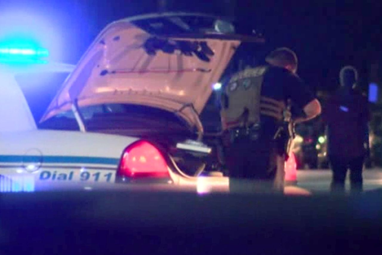 A police officer responds to a shooting at Savannah State.