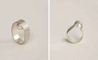 Two designs of a silver ring with inset oyster pearl.