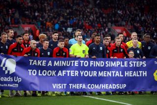 Players of Southampton and Huddersfield give their support to the Heads Up campaign