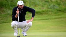 Scottie Scheffler lines up a putt at the 2025 Open