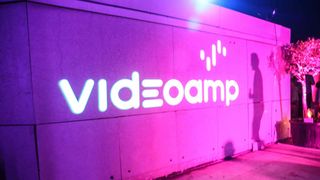 VideoAmp logo projected on a wall at Cannes party