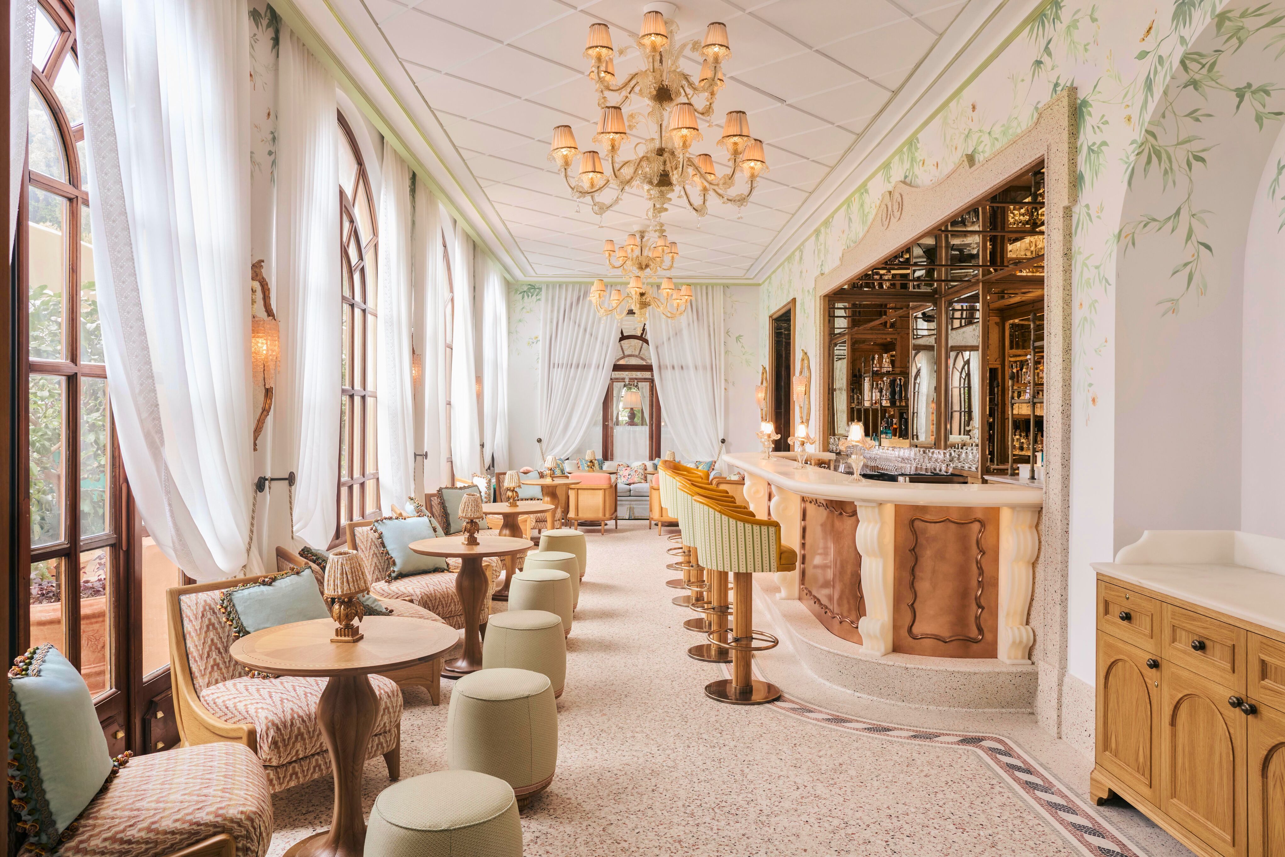 The pale green, dusky pink and vintage copper interior of the Baratta Sedici bar with botanical frescoes and semi-sheer white curtains