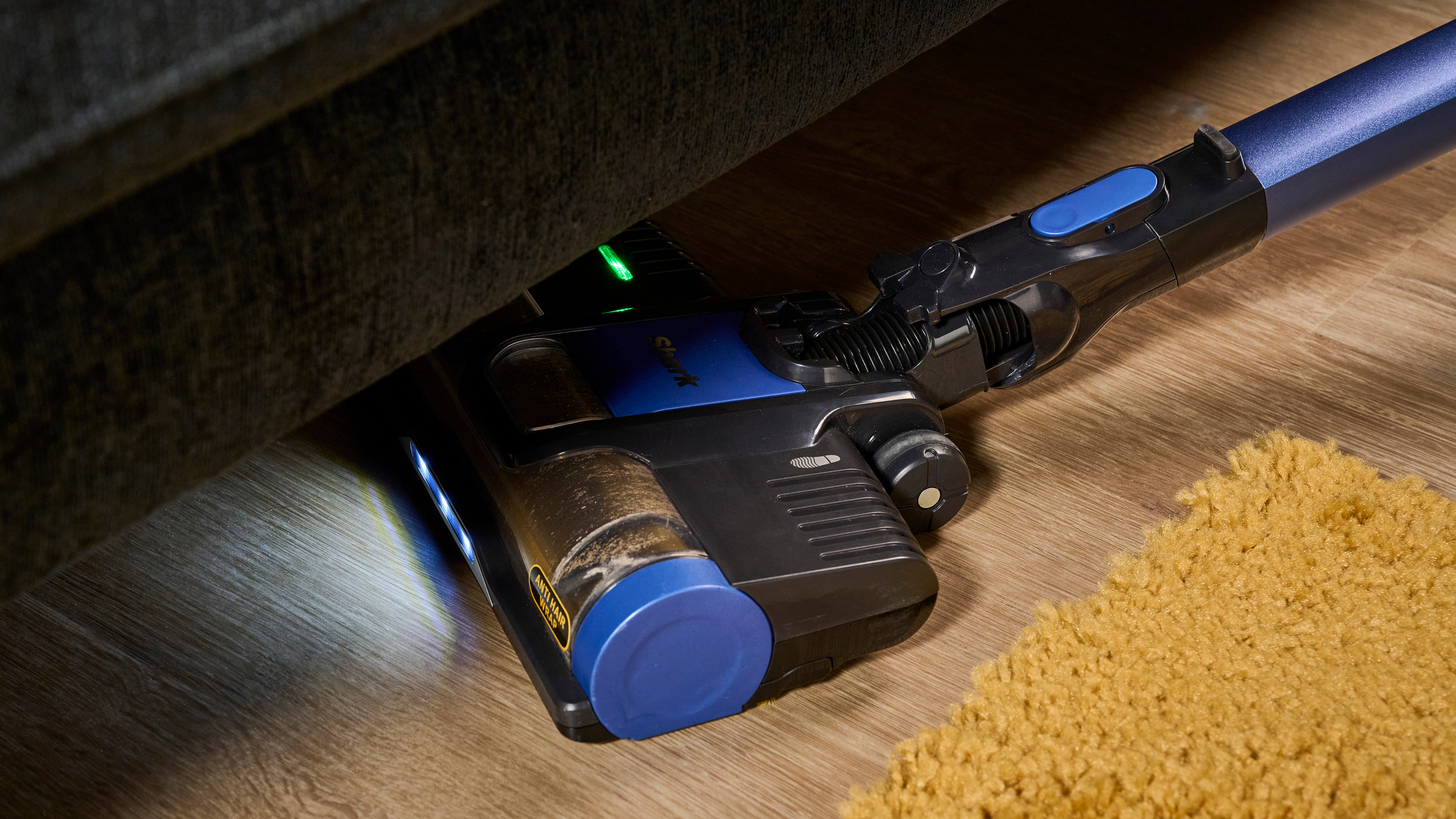 The Shark Anti Hair Wrap Cordless Vacuum features LED lighting on the floorhead