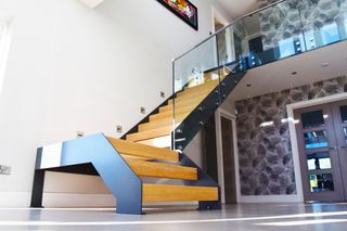 Model 500 staircase from Complete Stair Systems with steel stringer and timber treads