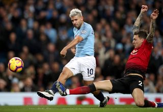 Sergio Aguero shoots after beating Manchester United’s Victor Lindelof