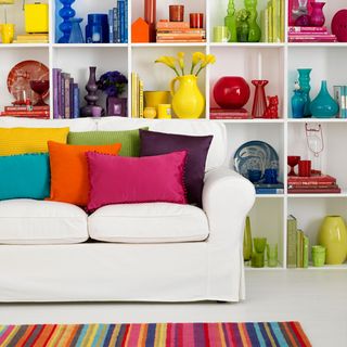living room with tableware and bright shelving