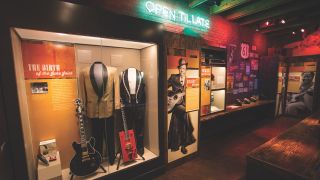 One of B.B. King’s “Lucille” guitars shares a display case with Bo Diddley’s red Gretsch G6138