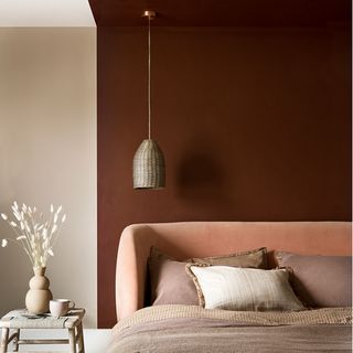best colour combinations, Brown wall with cushions and flower in vase