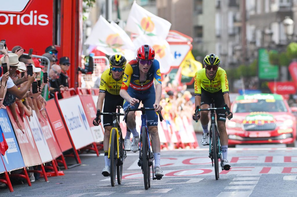 GRANADA SPAIN AUGUST 25 LR Sepp Kuss of The United States and Team Visma Lease a Bike Mattias Skjelmose Jensen of Denmark and Team Lidl Trek and Cristian Rodriguez of Spain and Team Arkea BB Hotels cross the finish line during the La Vuelta 79th Tour of Spain 2024 Stage 9 a 1785km stage from Motril to Granada UCIWT on August 25 2024 in Granada Spain Photo by Tim de WaeleGetty Images