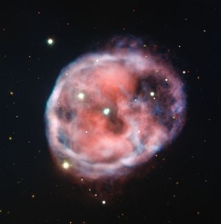 The Skull Nebula, seen here by the European Southern Observatory's Very Large Telescope, is an eerie sight shaped by two stars orbited by a third star.