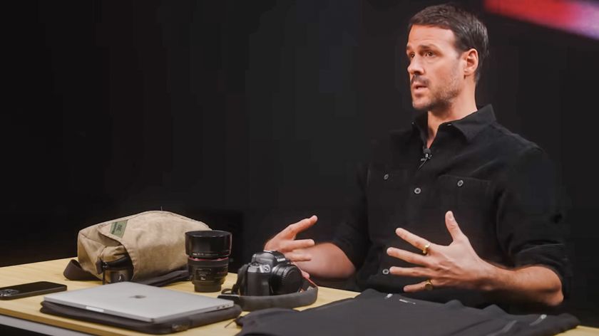 War photographer Jonathan Alpeyrie talking with his Canon EOS R camera on the table in front of him