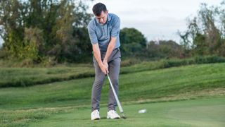 PGA pro Dan Grieve hitting a chip shot at Infinitum Golf Resort in Spain