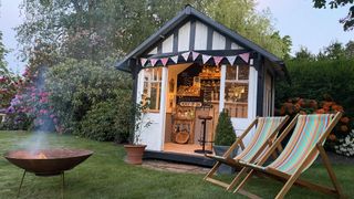 she shed transformed into a gin bar with bunting and deck chairs