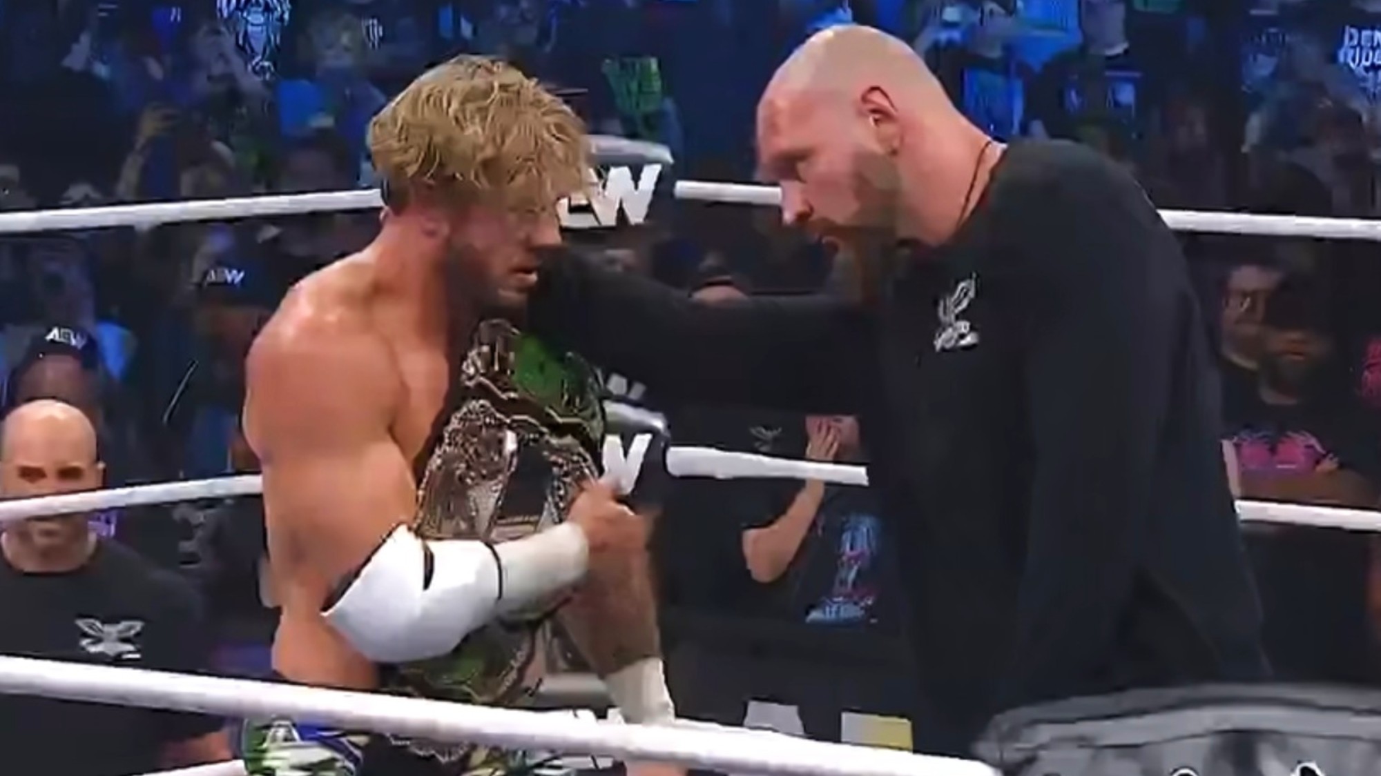 Jon Moxley having a stern talk with Will Ospreay in AEW