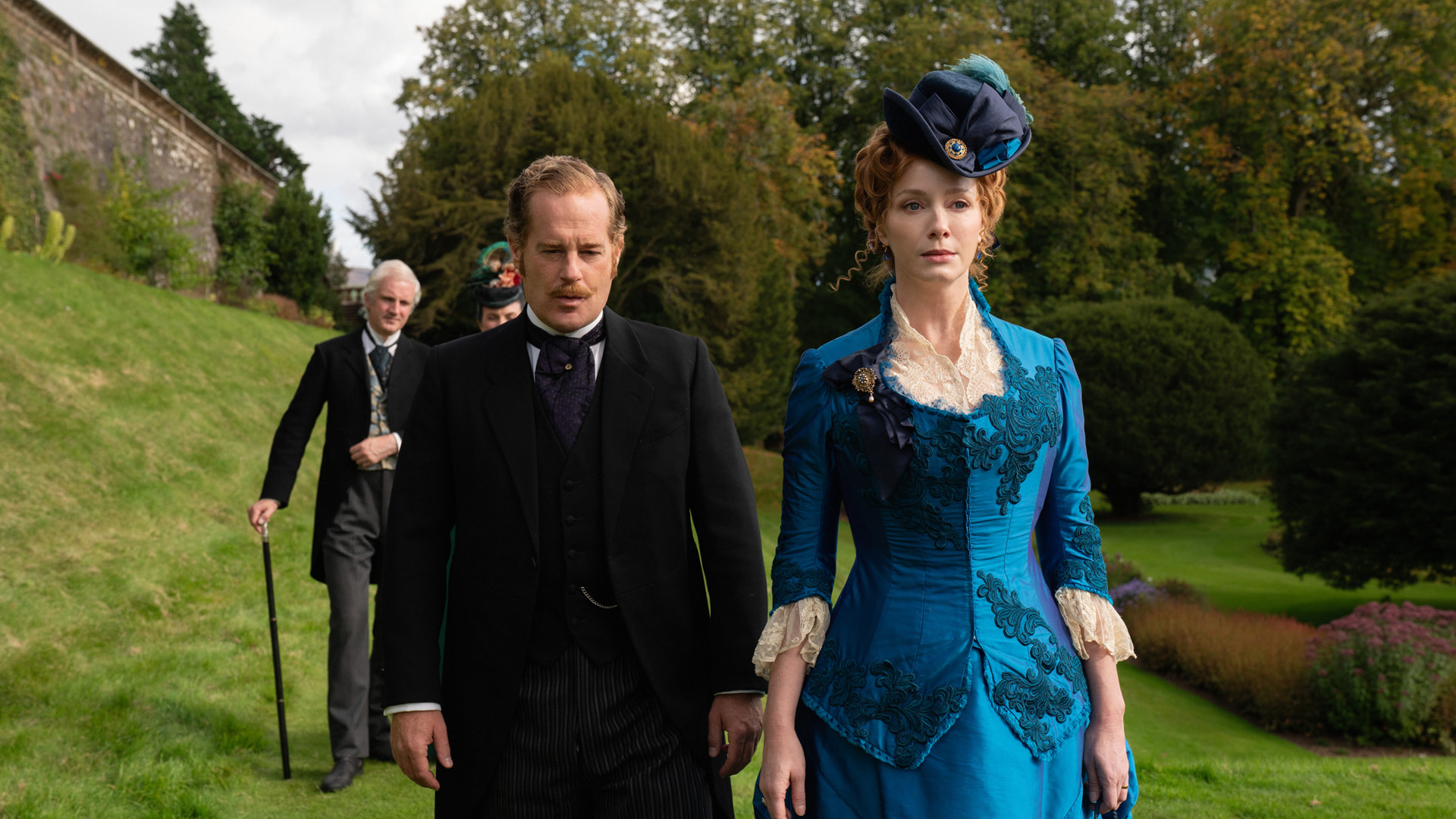 Adam James and Christina Hendricks in a scene from The Buccaneers season two