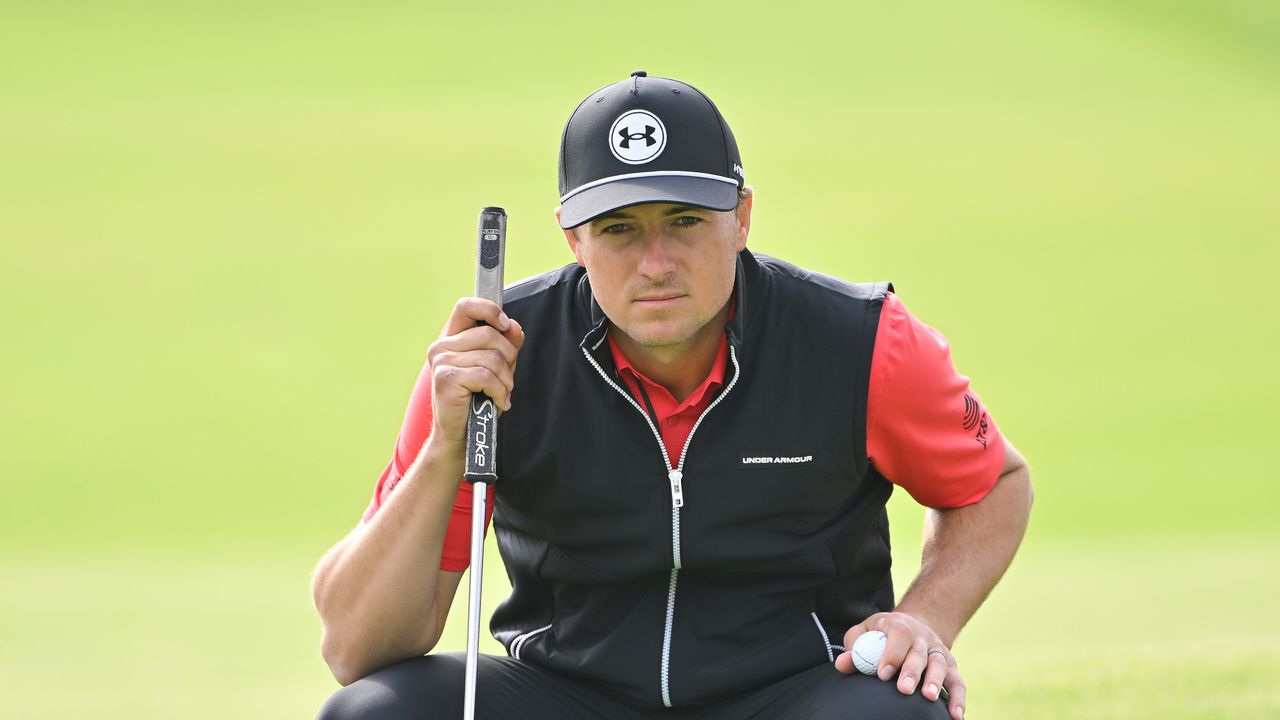 Jordan Spieth crouches down ahead of a putt during the second round at the 2024 Genesis Invitational