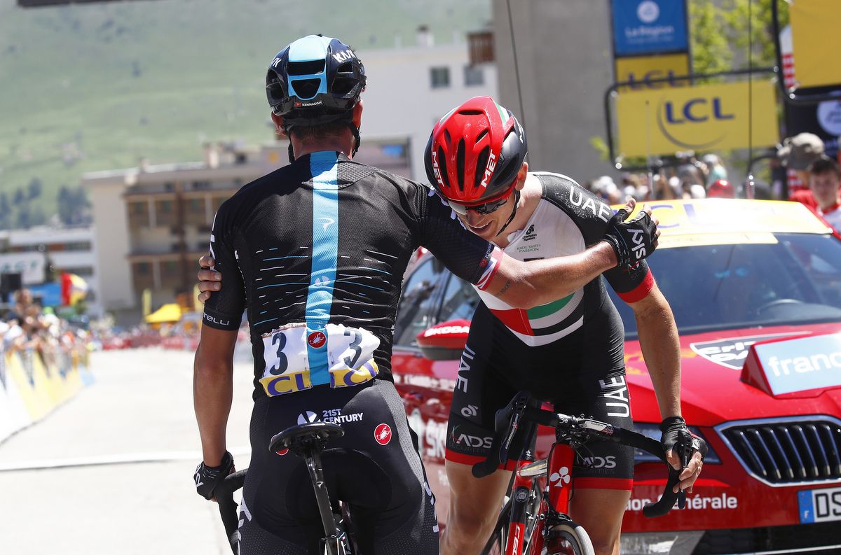 Peter Kennaugh and Ben Swift start to embrace