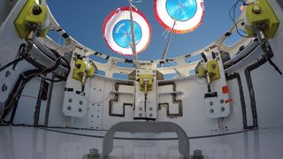 A view from the top hatch of Boeing's CST-100 Starliner boilerplate capsule after its parachutes deployed during a February 2017 test.