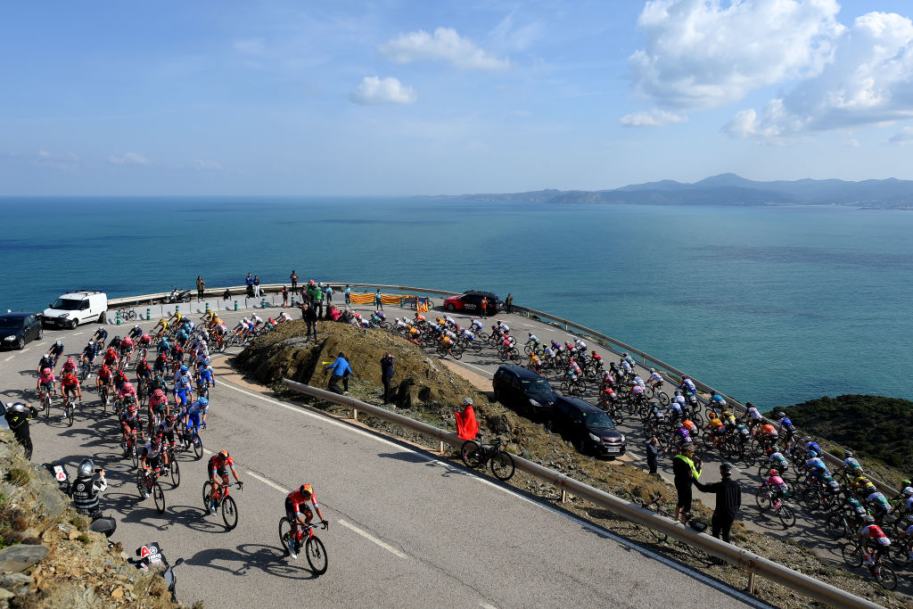 PERPIGNAN FRANCE  MARCH 22 A general view of the peloton passing through a sea landscape during the 101st Volta Ciclista a Catalunya 2022  Stage 2 a 2024km stage from LEscala to Perpignan  VoltaCatalunya101  WorldTour  on March 22 2022 in Perpignan France Photo by David RamosGetty Images
