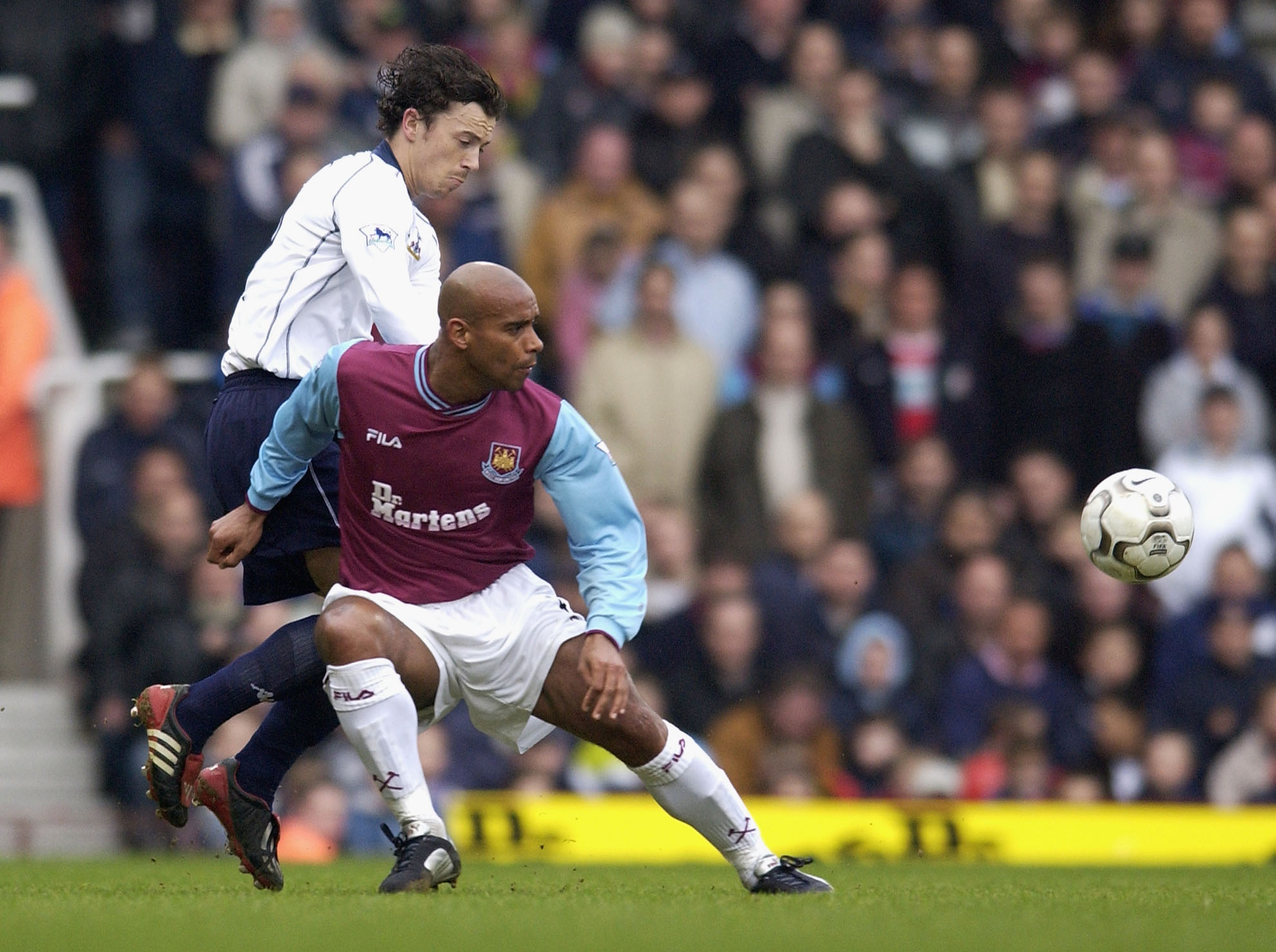 West Ham's Trevor Sinclar battles with Tottenham's Simon Davies in March 2003.