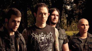 Trivium posing for a photograph in 2013