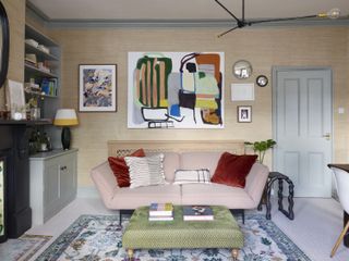 A living room with multiple art pieces