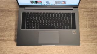 Honor MagicBook 16 (2022) review: laptop keyboard on a wooden table