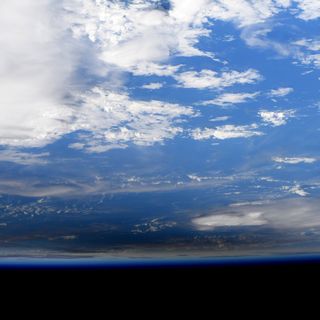 NASA astronaut Jessica Meir captured these photos of the Dec. 26, 2019 annular solar eclipse from the International Space Station. They show the moon's shadow moving across the surface of the Earth.