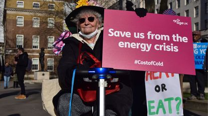 Old lady protesting against the cost of living crisis