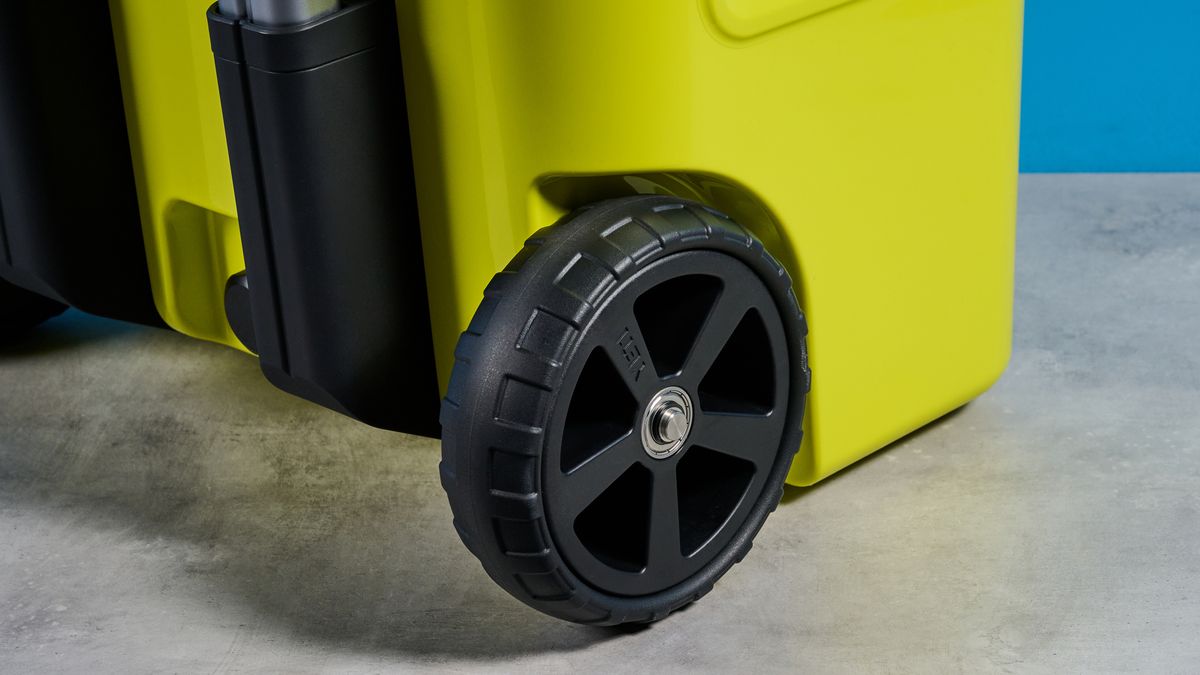 the yeti roader cooler in neon yellow with wheels, soft close hinges, a retractable handle, and 32 quart capacity