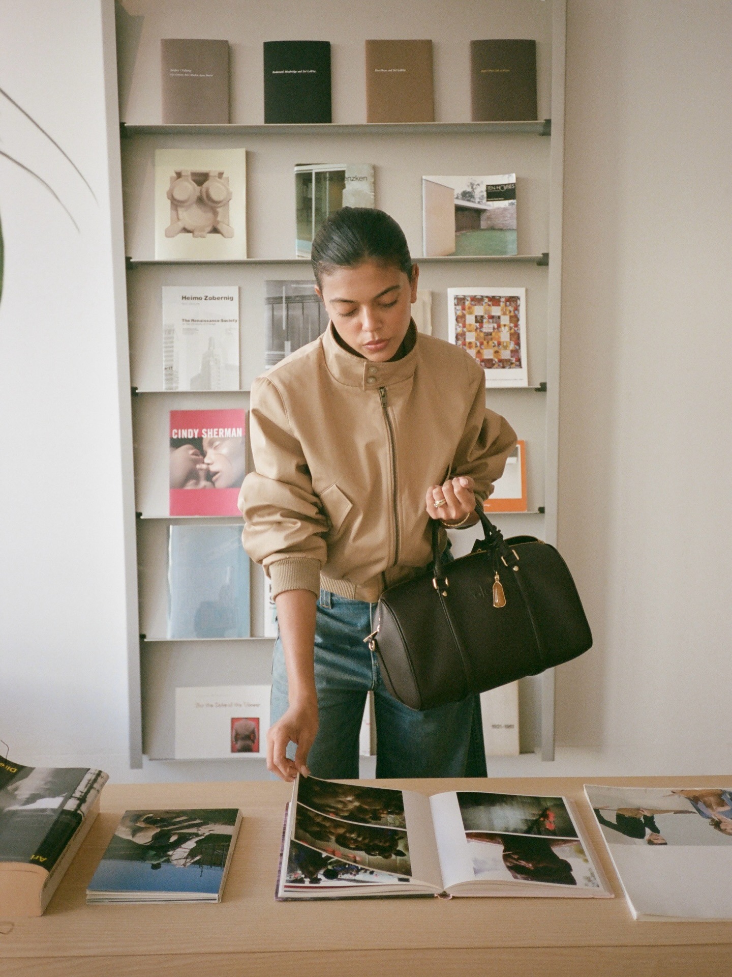Woman in funnel-neck jacket.