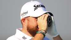 Shane Lowry using a rangefinder