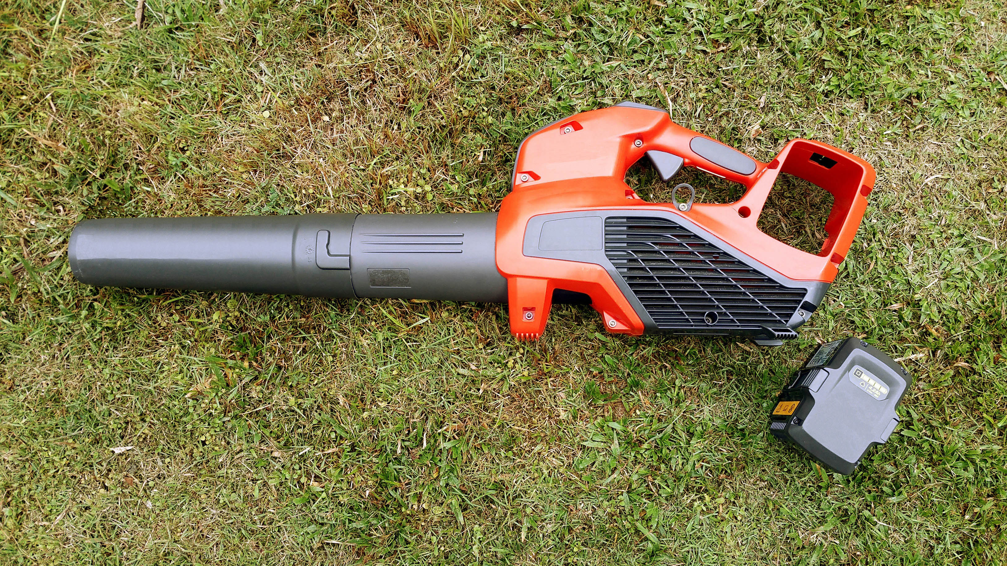 Leaf blower and battery on grass