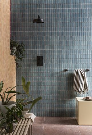 bathroom trends 2022 slim blue tiles in a shower room