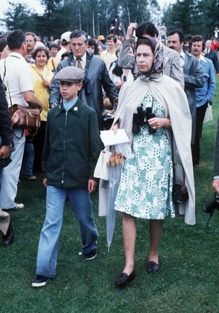 Queen Elizabeth II walks with Prince Edward to watch Princess Anne compete in the Equestrian event at the 1976 Summer Olympics on July 23, 1976 in Montreal, Canada