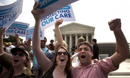 ObamaCare supporters celebrate Thursday after the Supreme Court rules that the bulk of President Obama's health-care overhaul is constitutional.