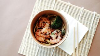 A bowl of noodles with seafood, a key meal in the Japanese diet