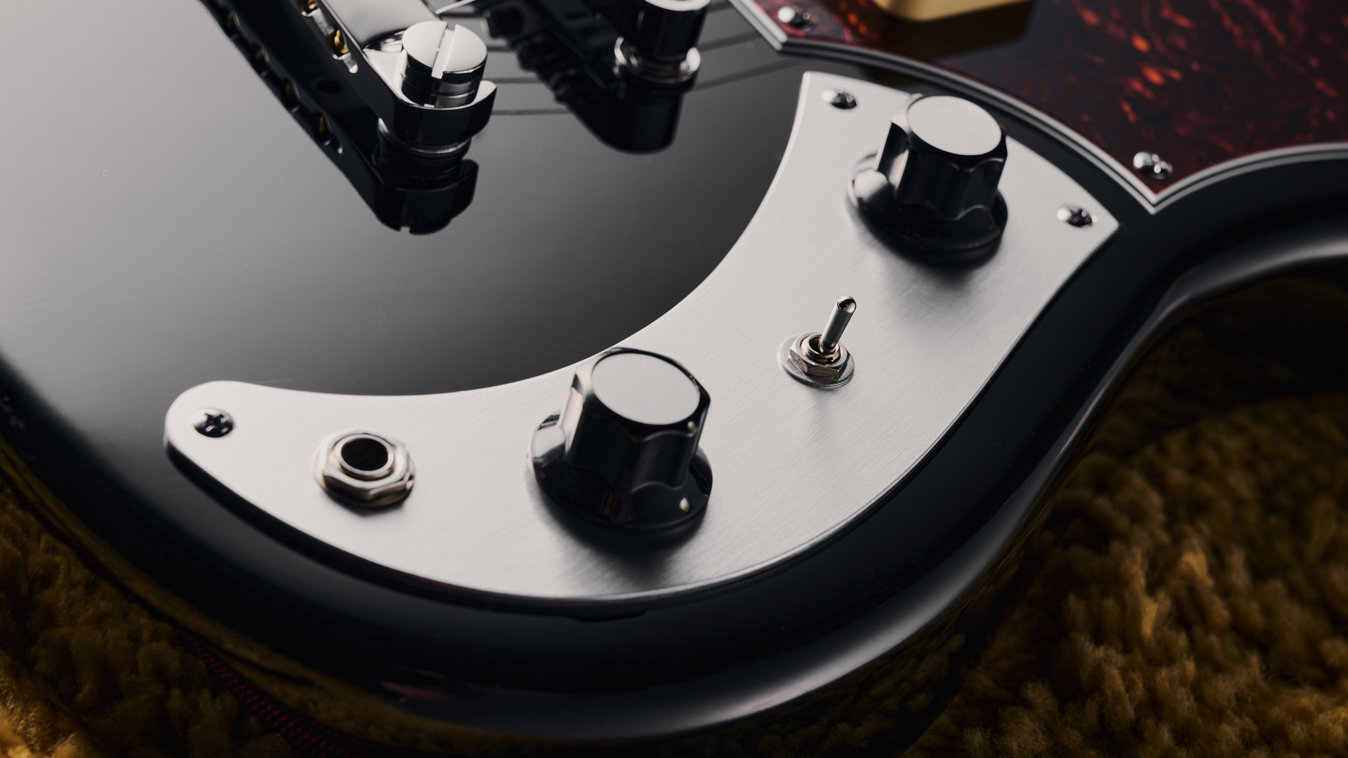 The controls and toggle switch of the Orangewood Del Sol Baritone guitar