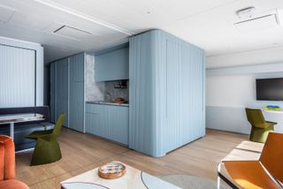 a small apartment with a fold down murphy bed