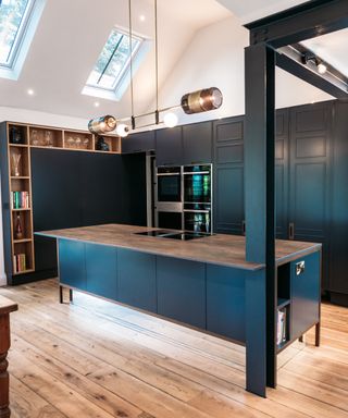 corner of kitchen showing dark blue steel vertical and horizontal beams