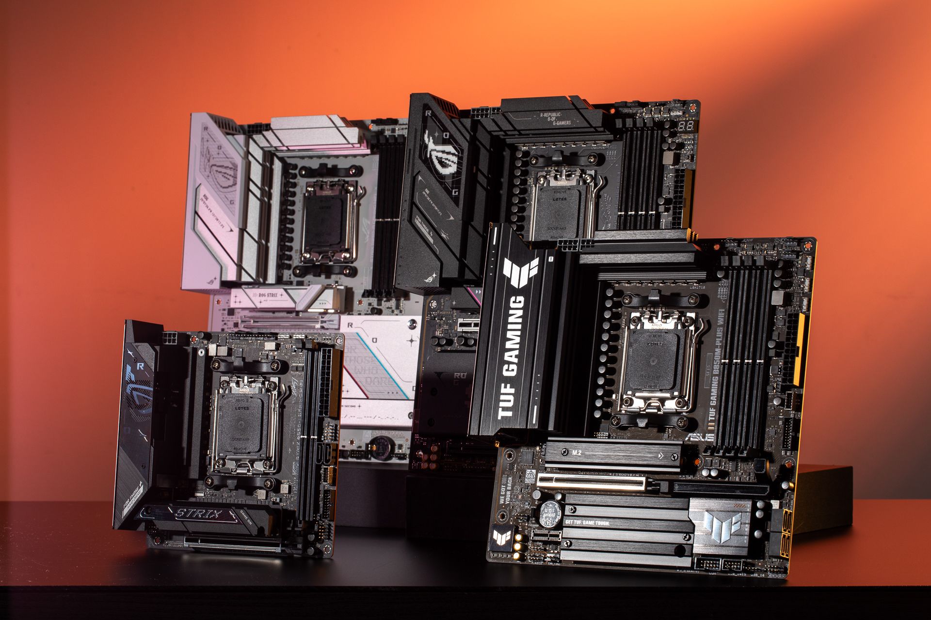 A promotional image showing a collection of Asus B850 motherboards