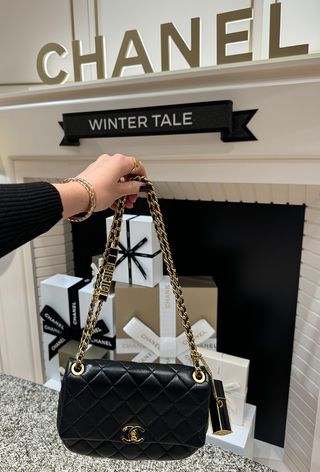 Chanel handbag with fragrance on chain