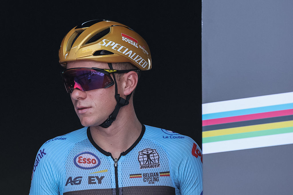 Belgian rider Remco Evenepoel reacts on the signature podium ahead of the men&#039;s Elite road race cycling event during the UCI 2025 Road World Championships, in Kigali, on September 28, 2025. (Photo by Anne-Christine POUJOULAT / AFP)