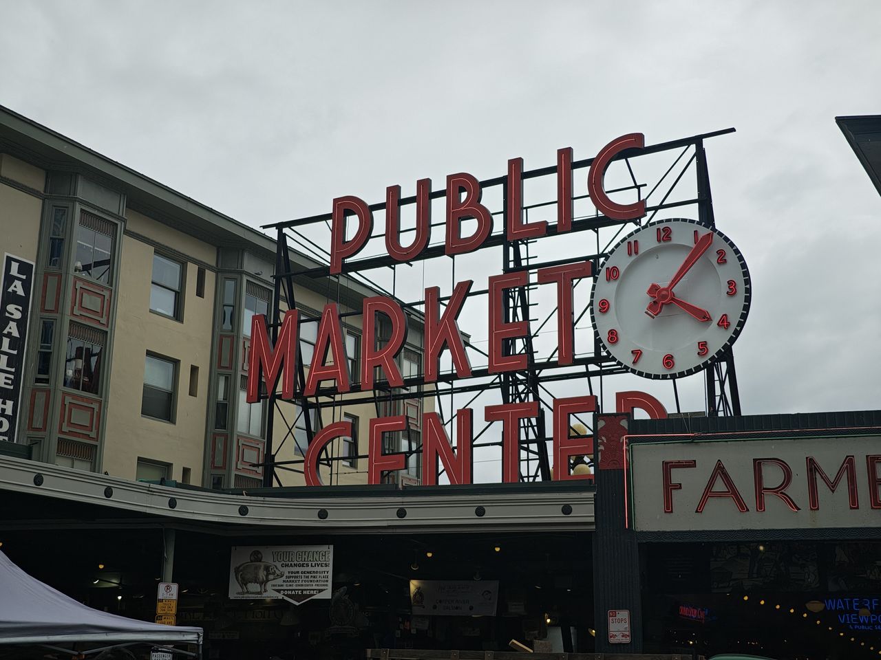 A red Public Market Center sign