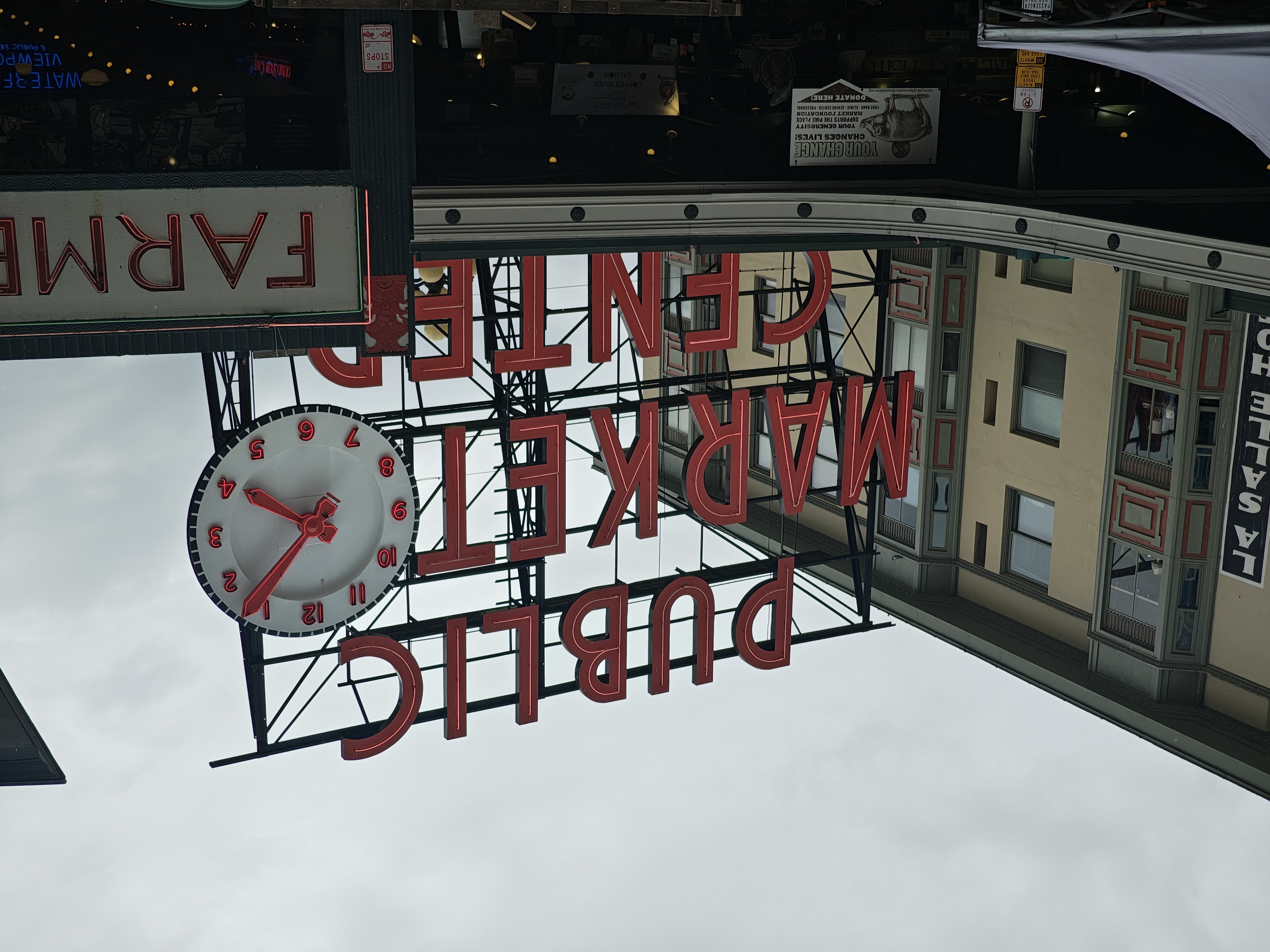 A red Public Market Center sign