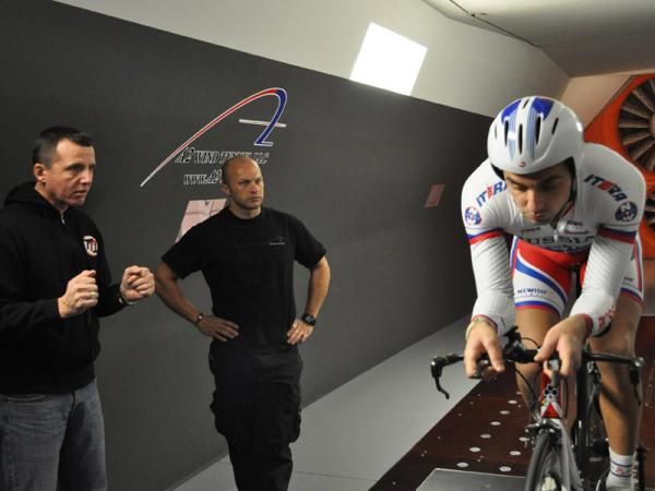 Team Type 1 directeur sportif Vassili Davidenko, left, and A2 Wind Tunnel's Mike Giraud, center, provide feedback for Alexey Shmidt.
